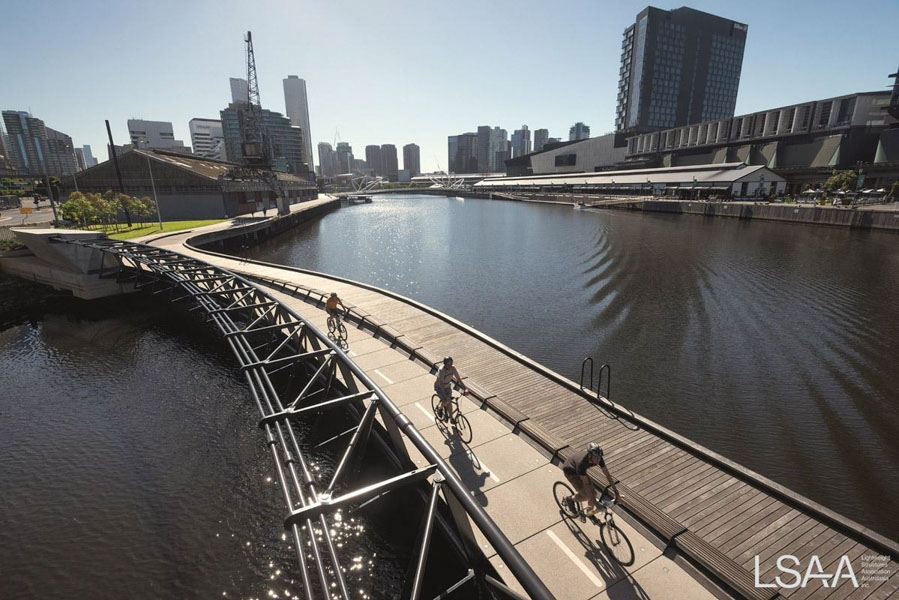 View of the curved Jim Stynes Bridge - Melbourne